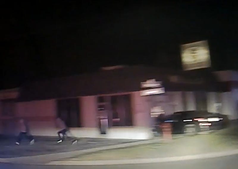 Teens running away after crashing stolen car into building
