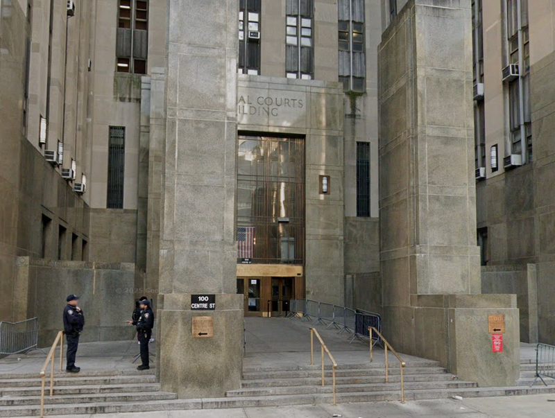 Two court officers were slashed inside the Manhattan criminal courthouse on Monday morning, and a suspect was taken into custody.