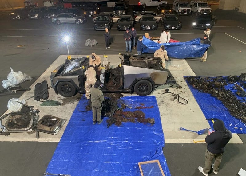 Investigators comb through a Tesla Cybertruck that exploded outside of the Trump International Hotel in Las Vegas on New Year's Day.
