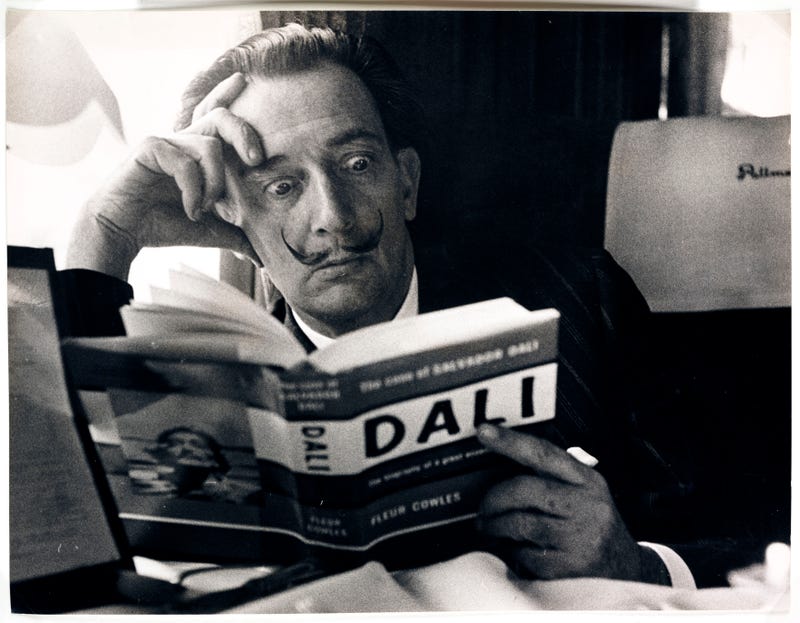 Dali reading his biography