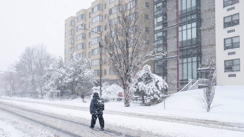  A person walks in the middle of 16th street during a snowstorm on January 3, 2022 in Washington, DC.