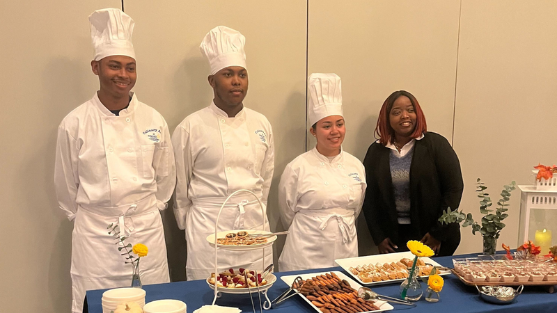 DCCC culinary students pose with some of their creations.
