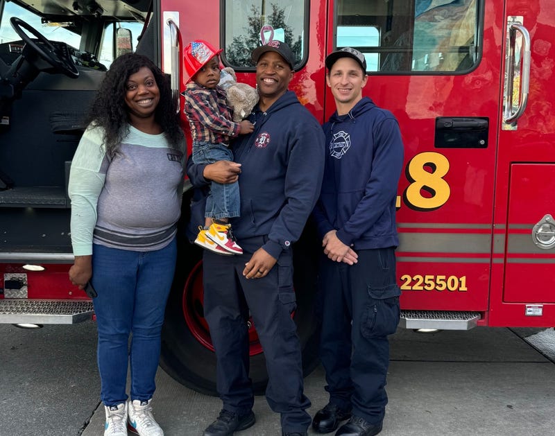 Detroit firefighters with Jasmine and Jayvion