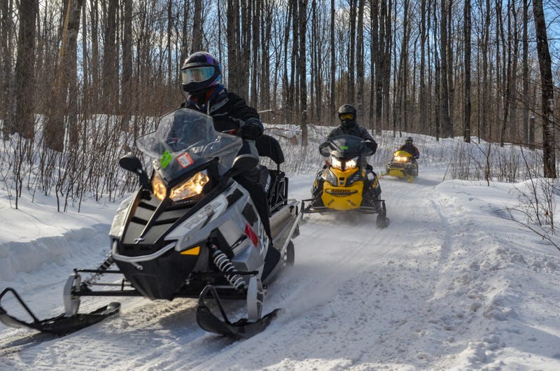 Snowmobiles on trail