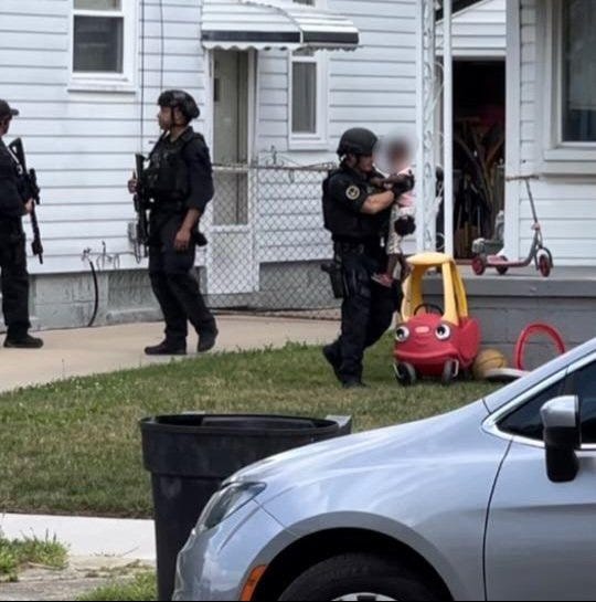 Police leaving home with child