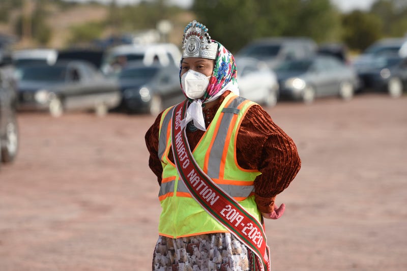 Shaandiin Parrish, Miss Navajo Nation, takes a brief pause while distributing food to Ganado community members