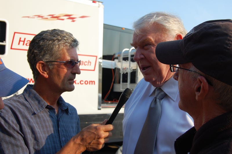Stan Bunger (with mic), John Madden and Steve Bitker record a segment for KCBS Radio ahead of Madden broadcasting "Sunday Night Football" from Lambeau Field in Green Bay, Wisconsin on September 21, 2008.