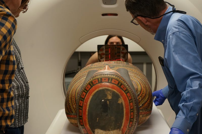 Field Museum researchers examine a mummy using a CT scan