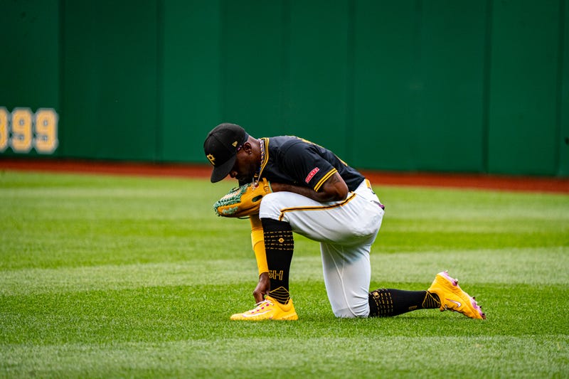 Andrew McCutchen kneeling in right field