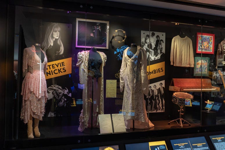 Stevie Nicks outfits including the dress from her "The Sorcerer" music video and other items on display.