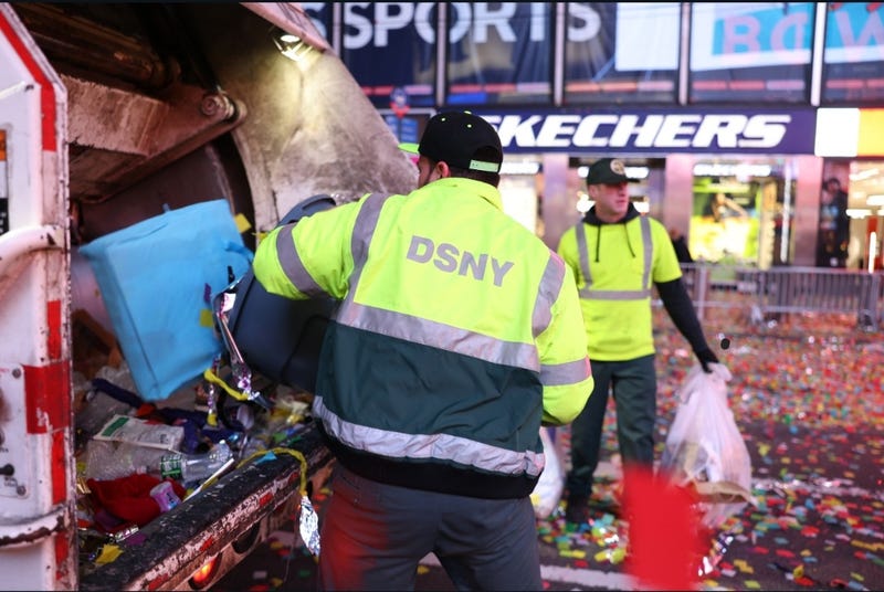 187 Department of Sanitation workers cleaned up 100,000 pounds of debris leftover from the Times Square New Year's Eve celebration.