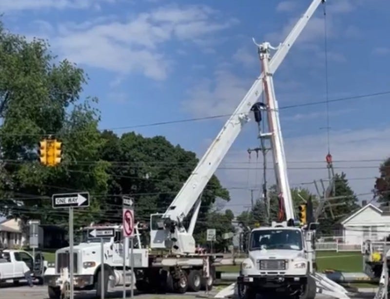 DTE Energy trucks working on power line