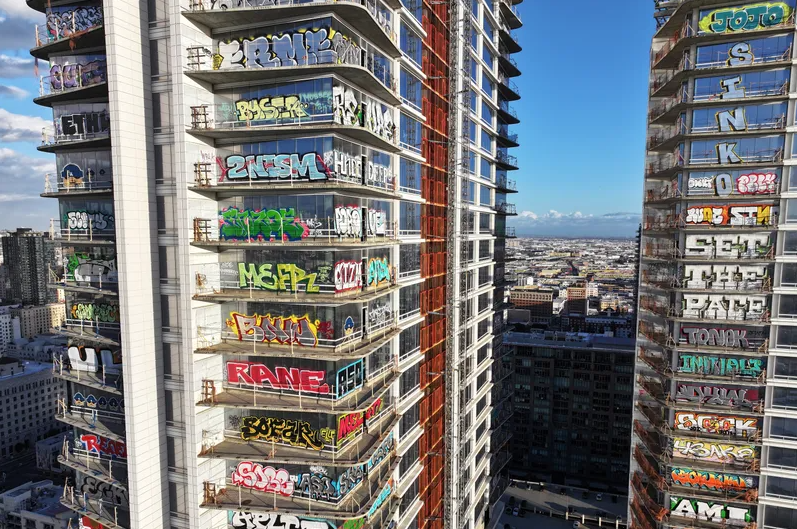 An aerial view of graffiti spray painted by taggers on at least 27 stories of an unfinished skyscraper development located downtown on February 2, 2024 in Los Angeles, California.