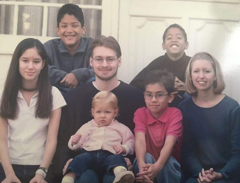 Dan Pearson (center), author of an Inquirer op-ed on transracial adoption, is pictured with his siblings and cousin.