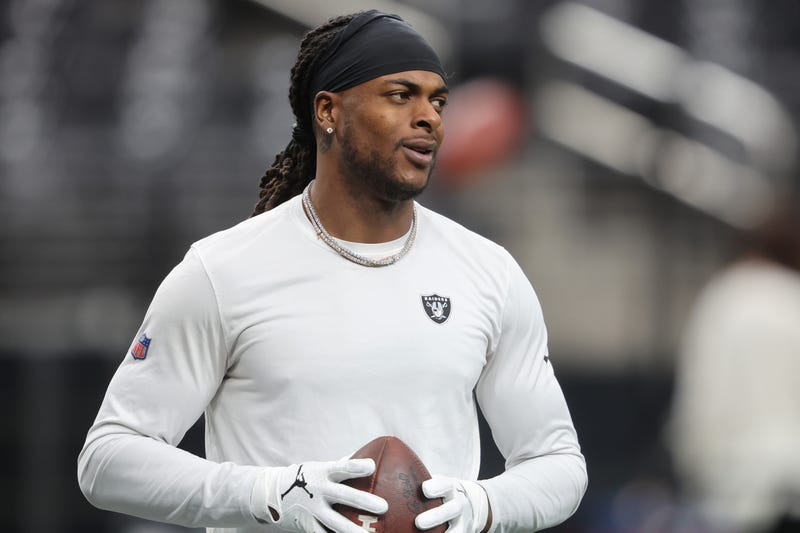 Raiders' WR Davante Adams warms up before a game