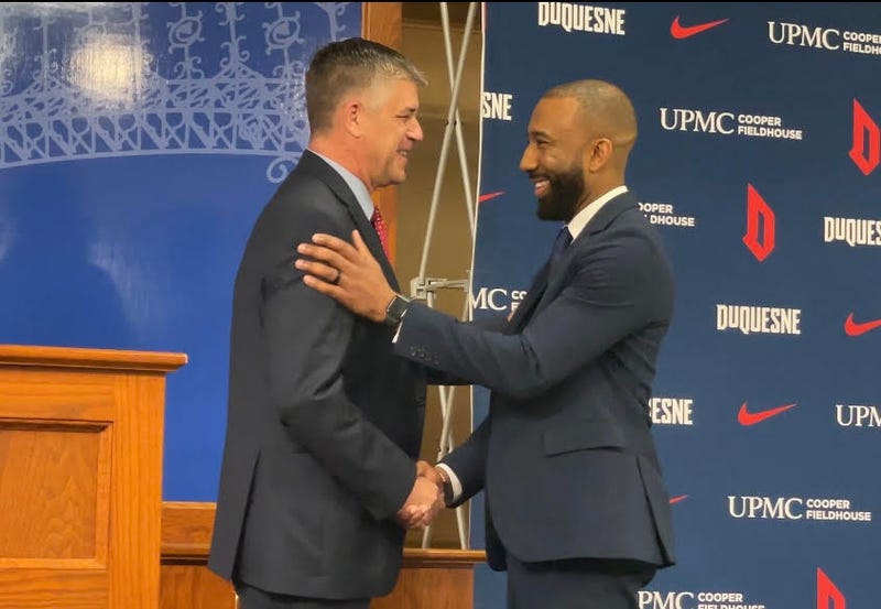 Duquesne AD Dave Harper shakes hands with Dru Joyce