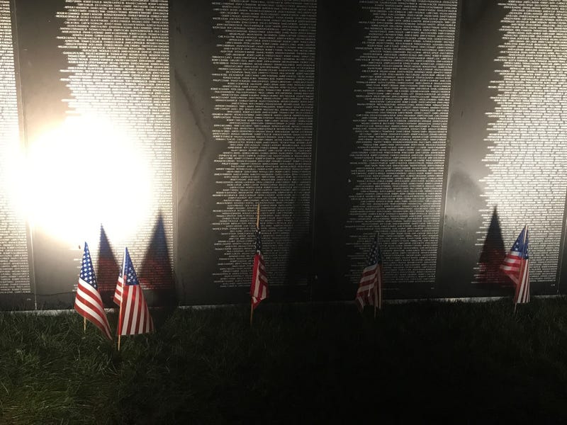American flags in front of the Traveling Vietnam Memorial Wall in Pittsburgh