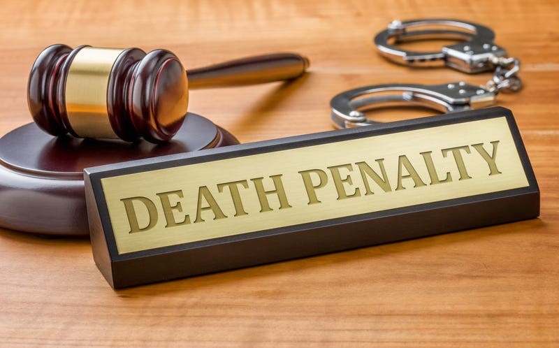 A death penalty plate sits in front of a judge's gavel