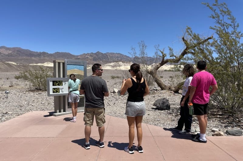 Visitors to Death Valley sizzle in the heat