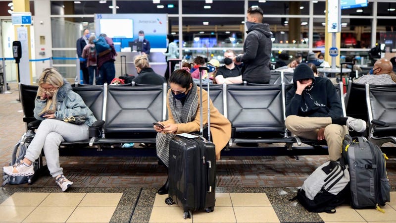 Passengers wait to board an American Airlines flight to Dallas at the Ronald Reagan Washington National Airport on November 24, 2021 in Arlington, Virginia. FAA expects the number of travelers for Thanksgiving to reach pre-pandemic levels, with more than 53 million people traveling in total in the days leading up to the holiday.