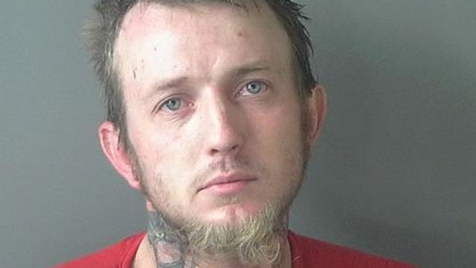 Booking photo of AMBER Alert suspect Derek Rowley