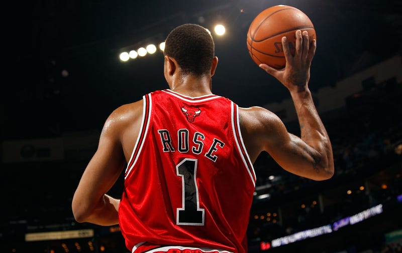Bulls great Derrick Rose looks to pass the ball during a game in 2012.