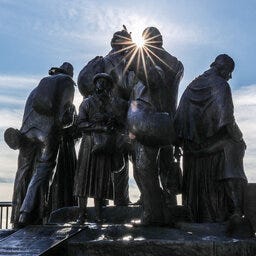 Detroit's Underground Railroad monument with the sun shining through from behind.