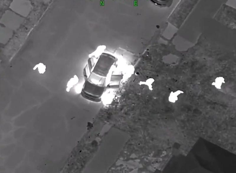 Seven suspects leaving stolen car