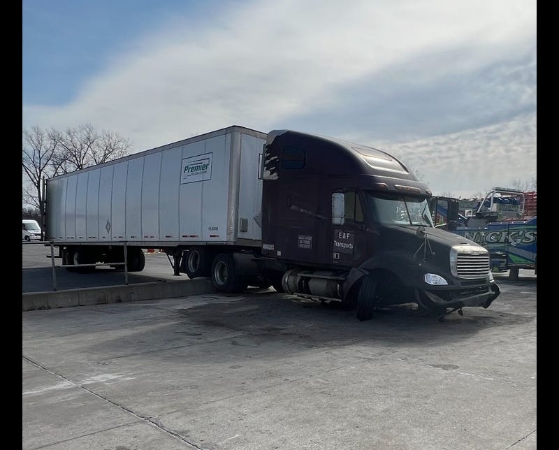 Semi-truck hits concrete abutment