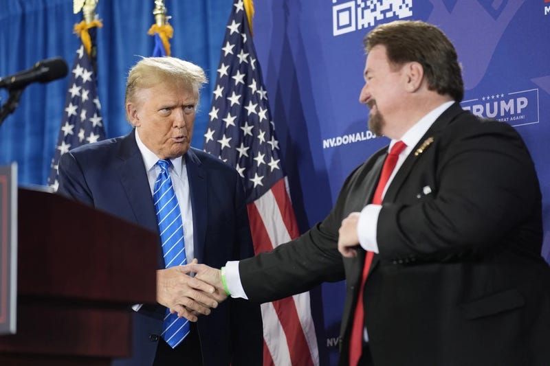 Nevada GOP Chainman Michael McDonald shakes hands with presumptive Republican Presidential nominee Donald Trump during a campaign event in Las Vegas on January 27th, 2024.