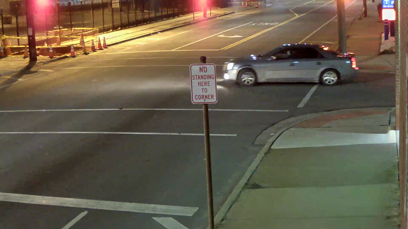The victims told police a male suspect in the rear passenger side of a silver Cadillac had shot at them. The Cadillac was described as having blue tape on top section of the windshield.