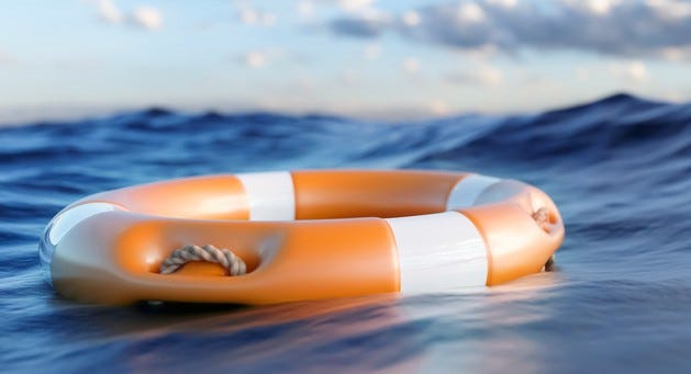 A flotation device drifts in the water with an incoming wave heading towards us