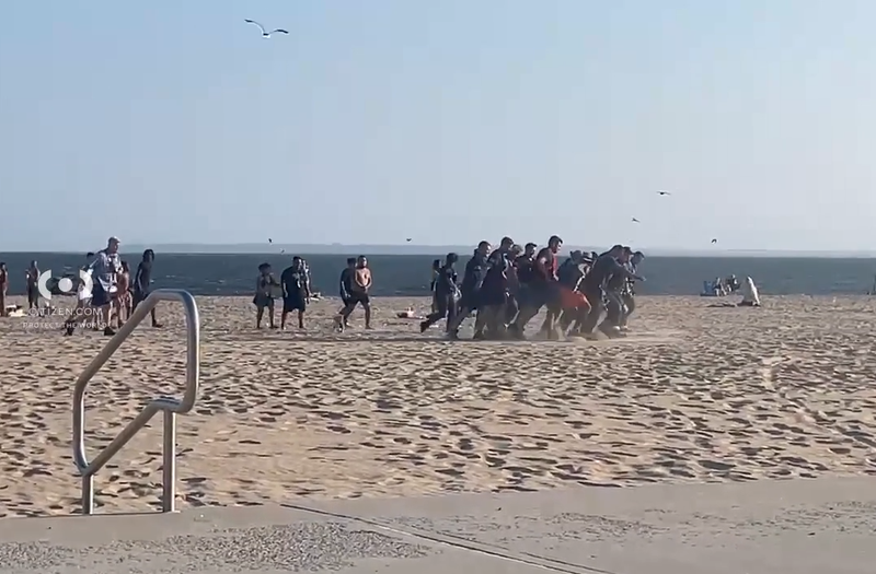 A woman was pulled from the waters off Manhattan Beach shortly after 6 p.m. Monday