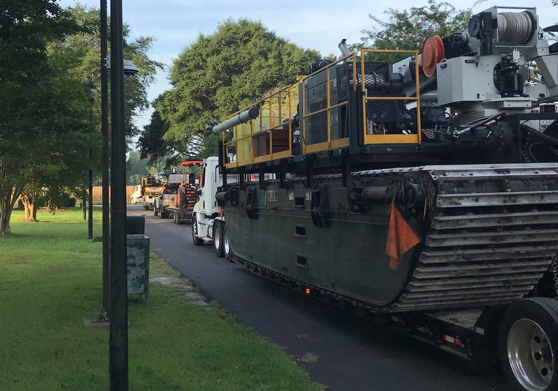 Duke Energy crews are bringing with them the heavy machinery they will need to assist in rebuilding the electric transmission system.