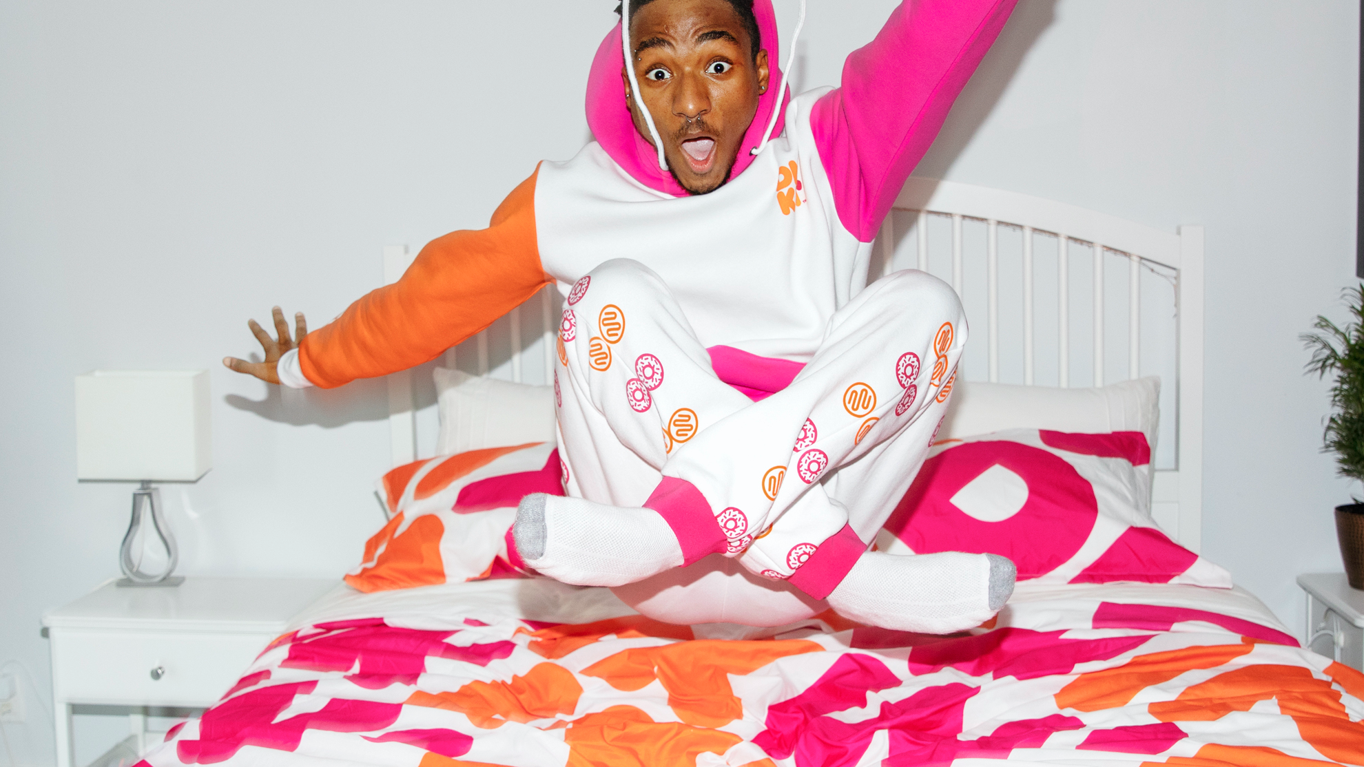 Dunkin' unveils limited-time holiday collection including tandem bike, bedding, and apparel