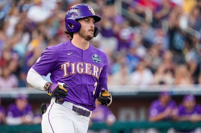 Dylan Crews runs to first base after hitting a single against the Tennessee Volunteers
