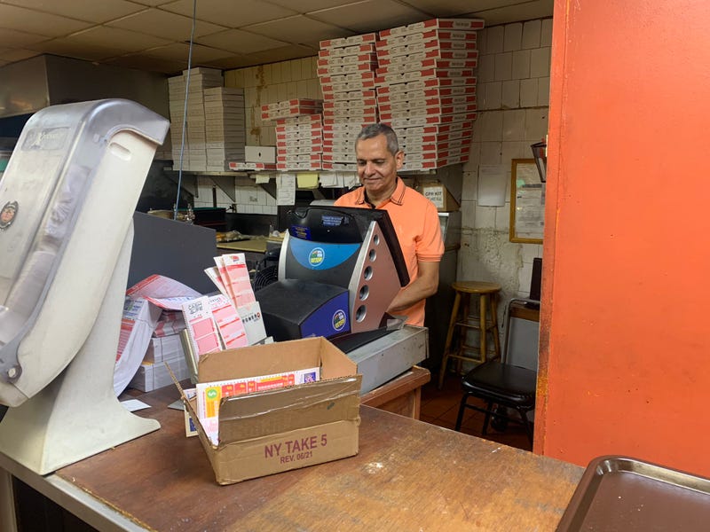Pronto Pizza owner David Khirala and his lottery machine on Wednesday morning
