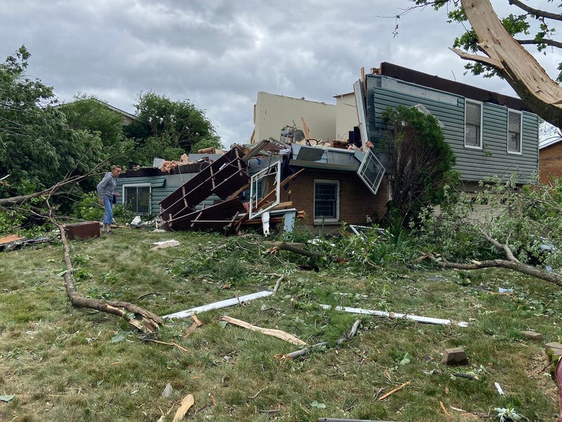 Beverly Sedleseck surveys the devastation of her boyfriend’s home in Woodridge. He’s in an assisted living facility and was not in the home when it was destroyed by Sunday night’s tornado.