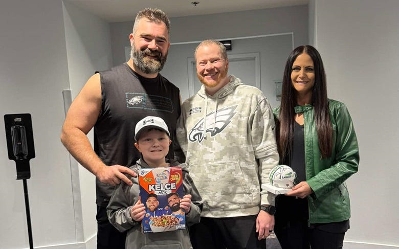Jason Kelse with the Thompson family