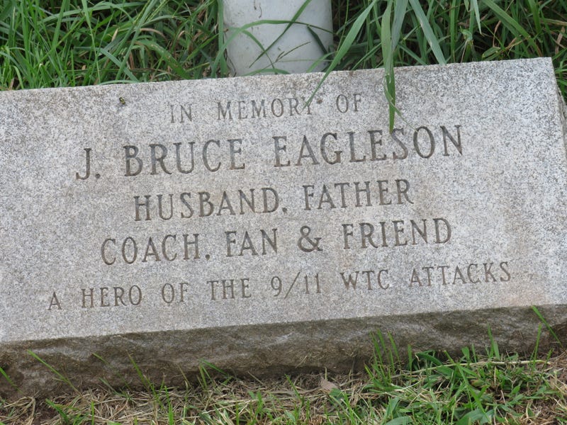 A memorial stone for Bruce Eagleson, set beneath the flagpole at Middletown Little League, where Bruce coached son Brett.