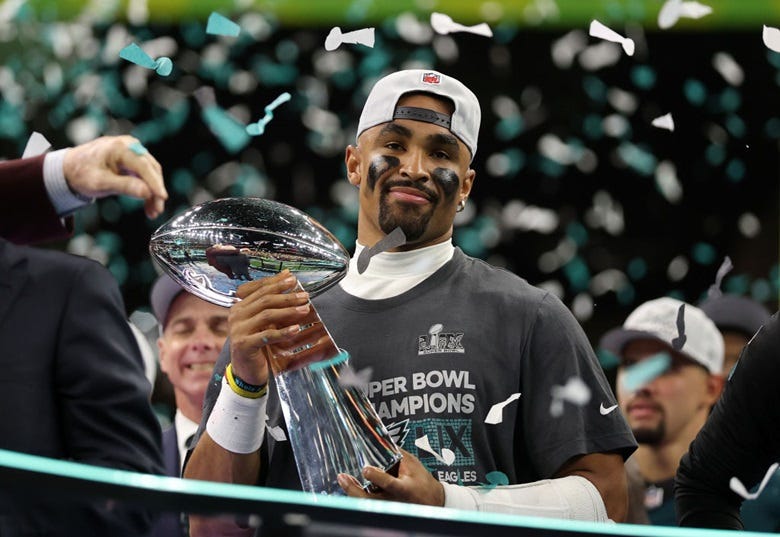 Jalen Hurts holding Super Bowl trophy 