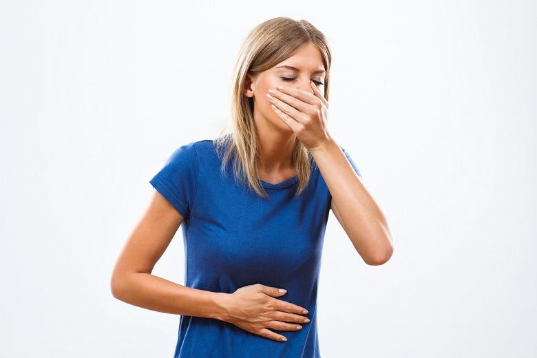 woman with hand over mouth