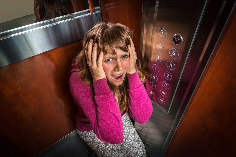 woman stuck in elevator 