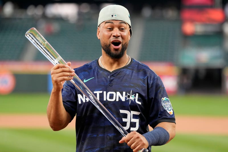 Elias Diaz with the All-Star Game MVP trophy