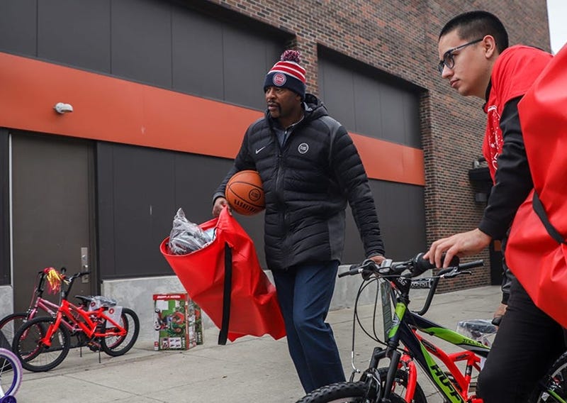 Earl Cureton helps during Toys for Tors program in Detroit