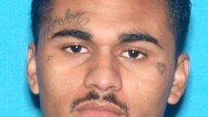 Anaheim police searching for parolee wanted in alleged gang murder of innocent man