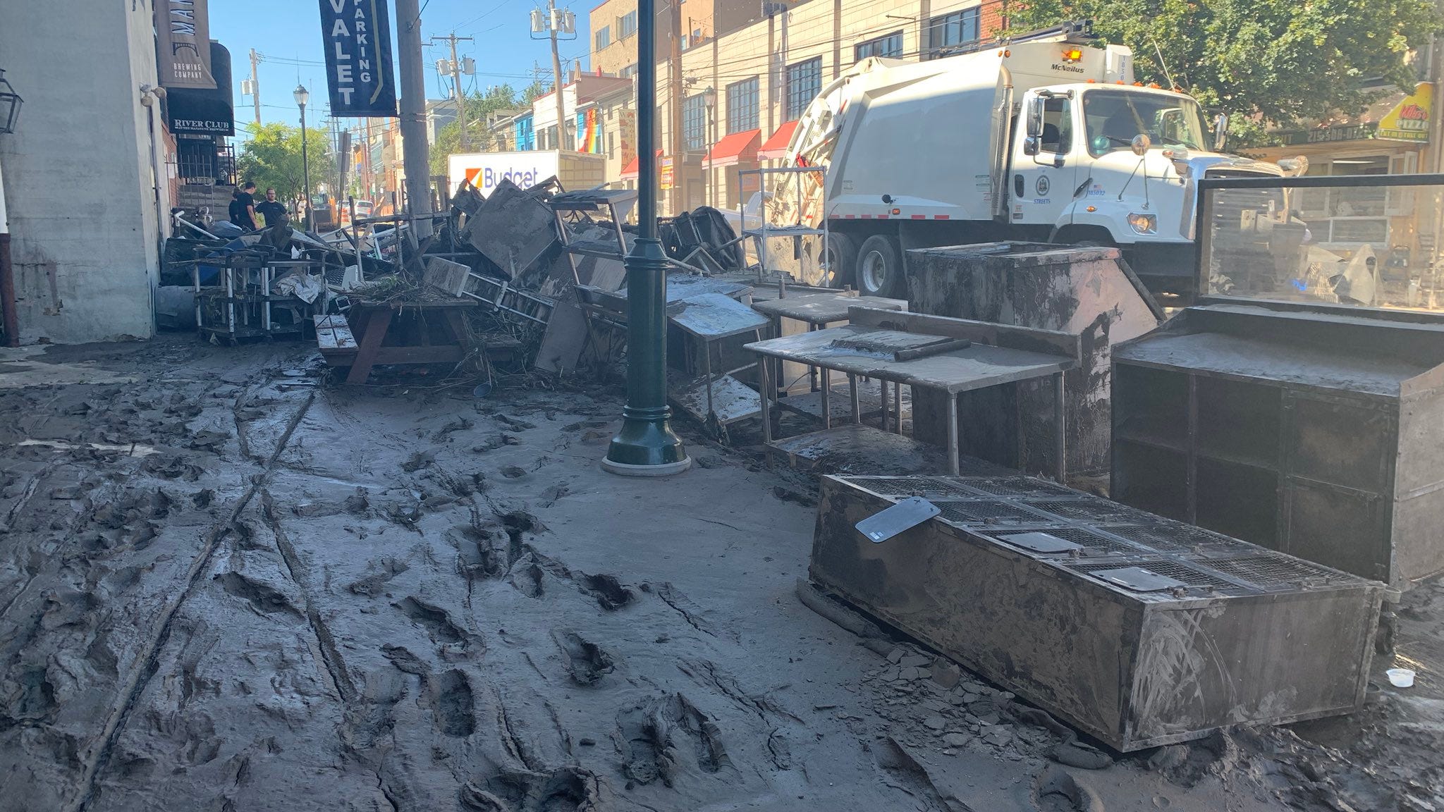 Main Street covered in mud as Manayunk cleans up after Ida
