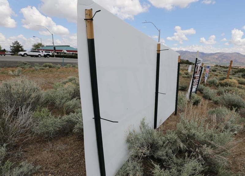 The back of an election sign sitting in the Nevada desert