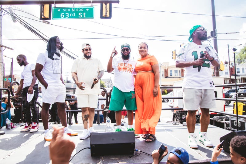 LaTrista Webb (second from right) shares the stage at the Elevation Project's record clearing clinic block party on July 29, 2023 with rappers Peedi Crakk, Freeway and Beanie Sigel.