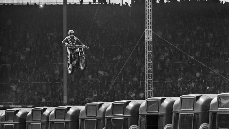 Motorcycle stunt rider Evel Knievel (1938 - 2007) attempts to jump 13 AEC Merlin buses at Wembley Stadium, London, 26th May 1975.